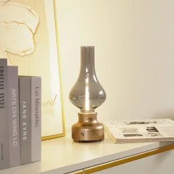 Lindby LED genopladelig bordlampe Maxentius guldfarvet glas dæmper