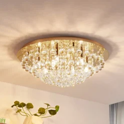 Lindby loftlampe Gillion, 8 lyskilder, guld, krystal, Ø 55cm