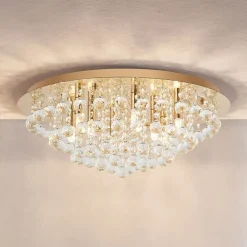 Lindby loftlampe Gillion, 8 lyskilder, guld, krystal, Ø 55cm