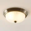 Lindby loftlampe Pakka, messingfarvet, glas, 31 cm, E27
