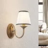 Lindby væglampe Lumiel, creme/messing, tekstil, 27 cm