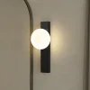 Lindby væglampe Tavrik, sort/hvid, højde 30 cm, glas