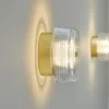 LOOM DESIGN LED-væglampe Glow guldfarvet/klar Ø 16 cm akryl