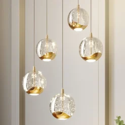 Lucande LED-pendellampe Hayley, Ø 30 cm, 5 lyskilder, guld, glas