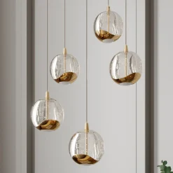 Lucande LED-pendellampe Hayley, Ø 30 cm, 5 lyskilder, guld, glas